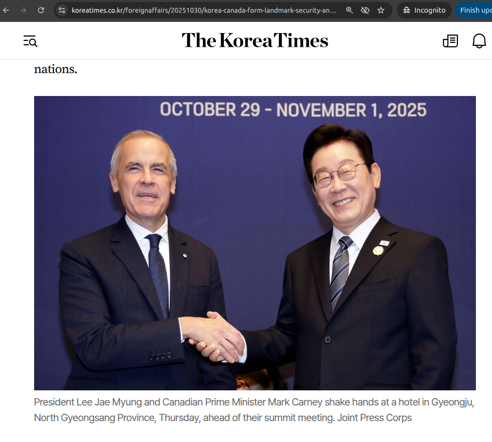 Close-up of Carney's grimace during handshake with Lee